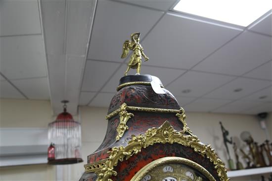 A 19th century French Louis XVI style ormolu and red boulle bracket clock, clock 41.5in. with matching wall bracket (14in.)